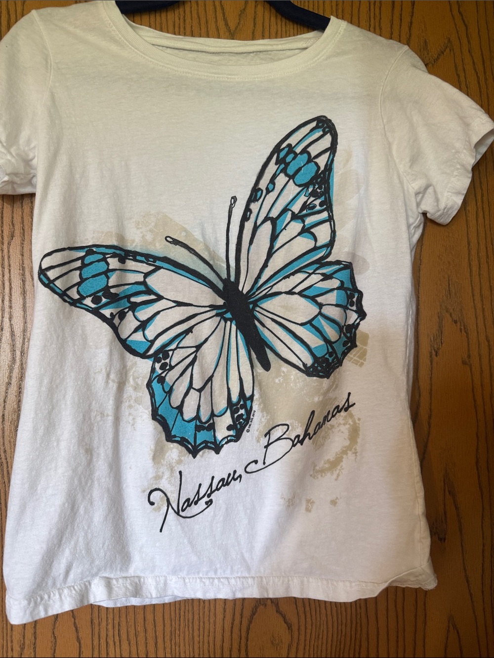 Delsol White Short Sleeve Tee with Blue Butterfly - Nassau Bahamas changes color